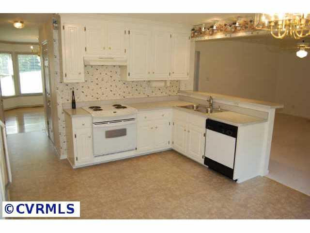 11905 Taplow Road Midlothian, VA 23112 - Photo 3 of 10 a kitchen with stainless steel appliances granite countertop a sink and cabinets