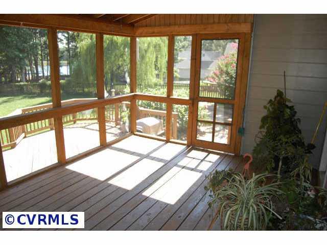 11905 Taplow Road Midlothian, VA 23112 - Photo 7 of 10 a view of porch with wooden floor and floor to ceiling window