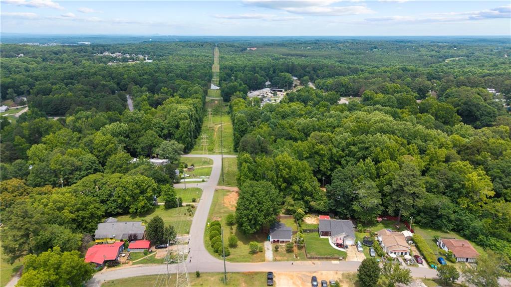 156 Pine Avenue Commerce, GA 30529 - Photo 35 of 35 an aerial view of residential houses with outdoor space and trees