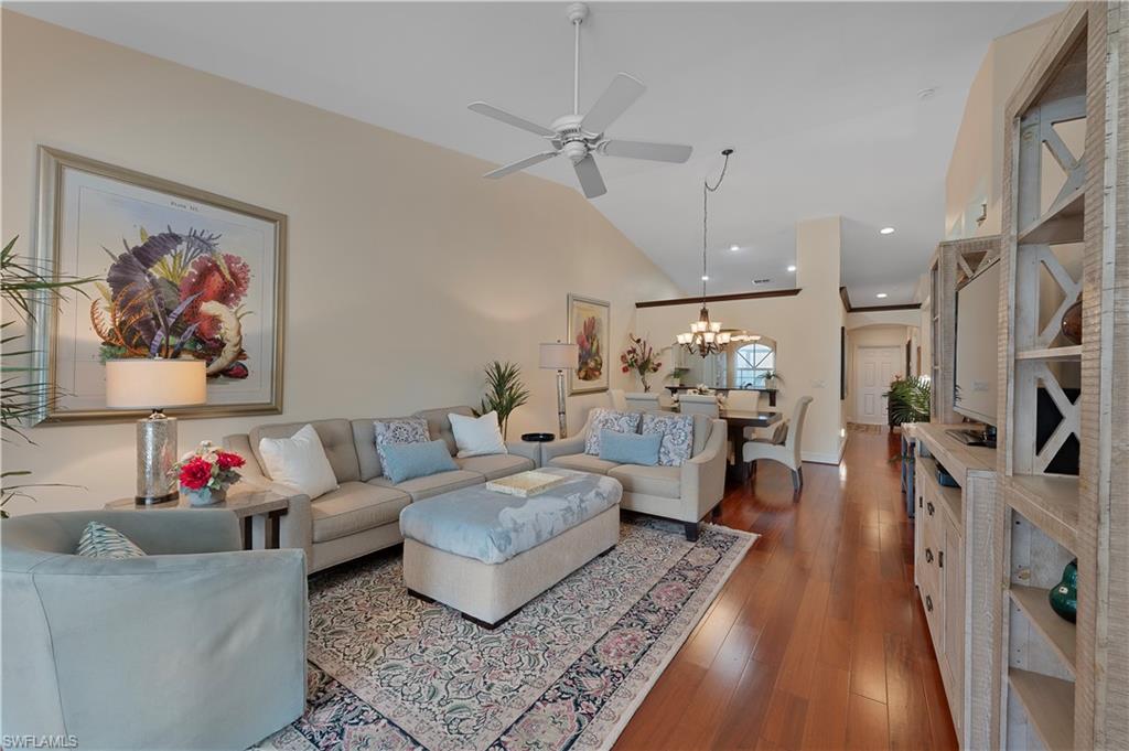 2166 Stacil Circle Naples, FL 34109 - Photo 12 of 18 a living room with furniture and a wooden floor