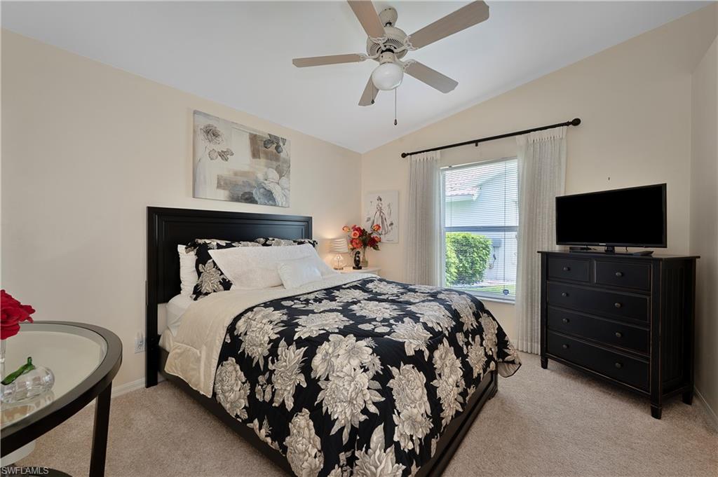 2166 Stacil Circle Naples, FL 34109 - Photo 15 of 18 a bedroom with a bed and a flat screen tv