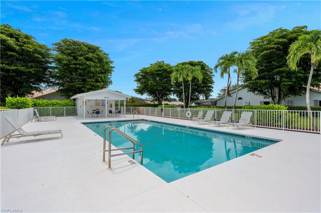 2166 Stacil Circle Naples, FL 34109 - Photo 7 of 18 a view of a swimming pool with a deck