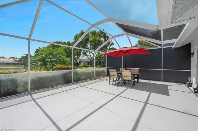 a view of a chairs and table in the patio