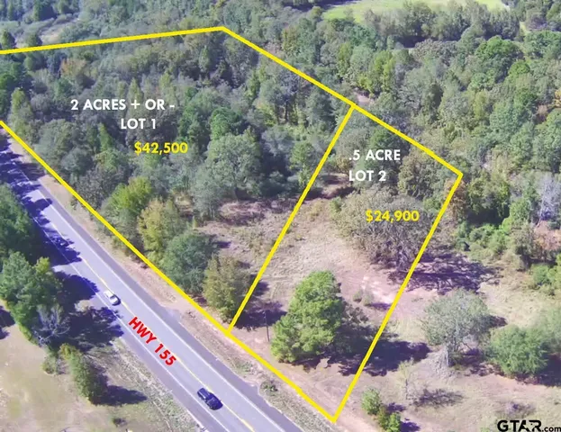 a view of a balcony with wooden floor and bench