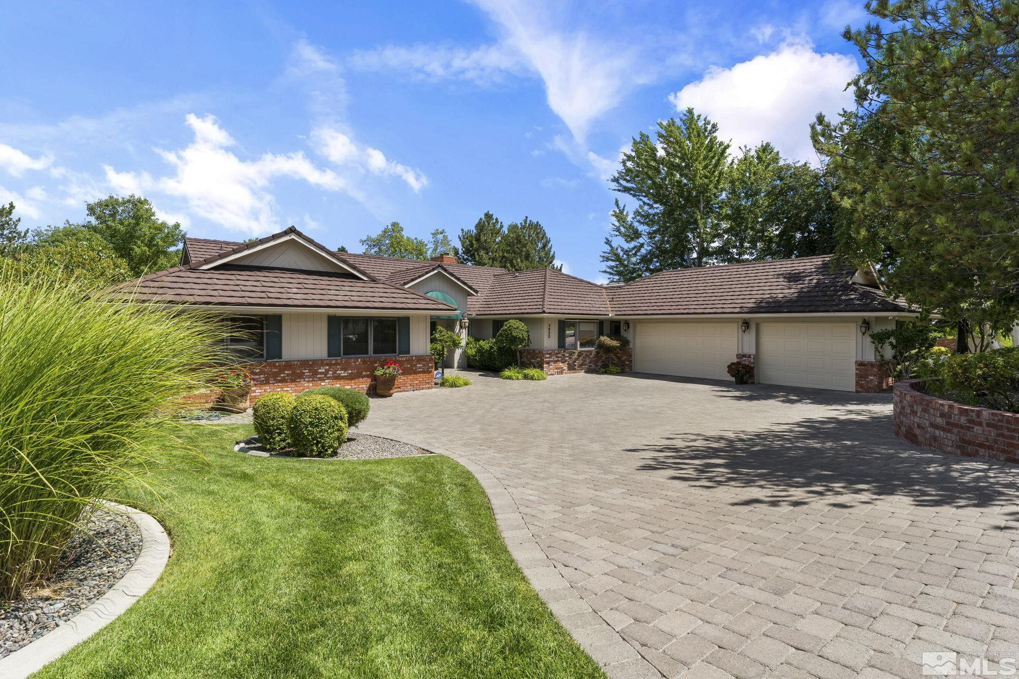2650 Spinnaker Drive Reno, NV 89519 - Photo 1 of 40 a front view of a house with garden