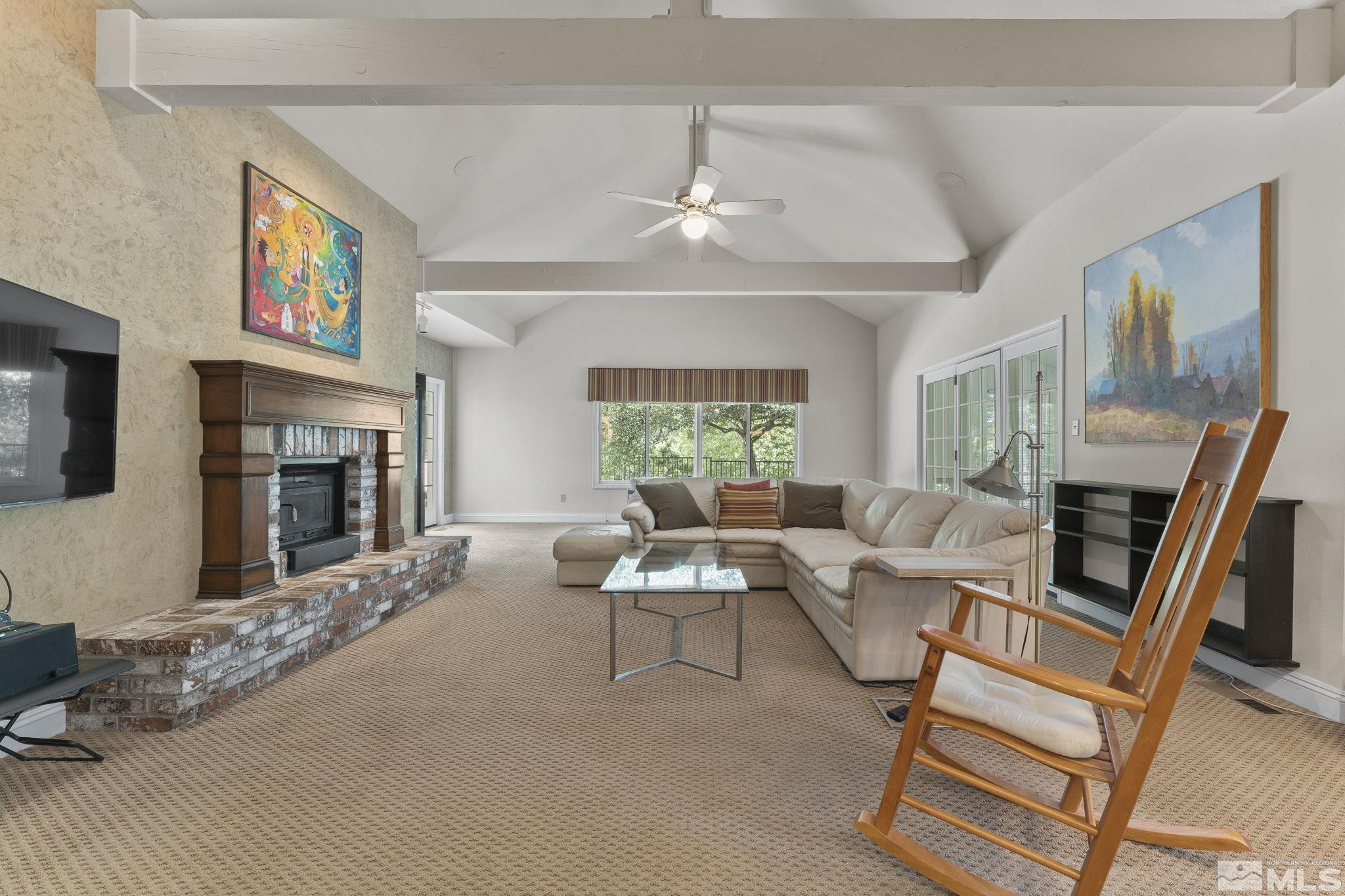 2650 Spinnaker Drive Reno, NV 89519 - Photo 12 of 40 a living room with fireplace furniture and a large window