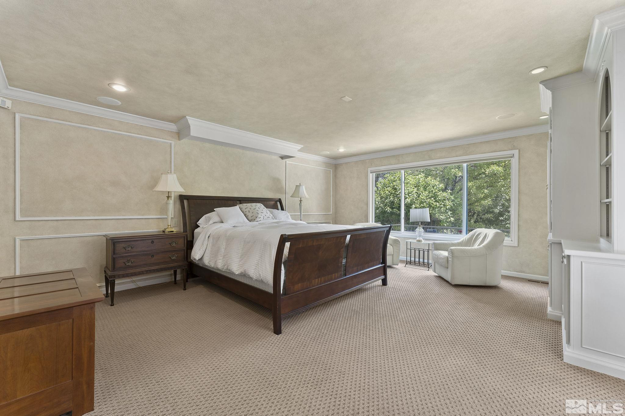 2650 Spinnaker Drive Reno, NV 89519 - Photo 17 of 40 a bedroom with a bed and white walls