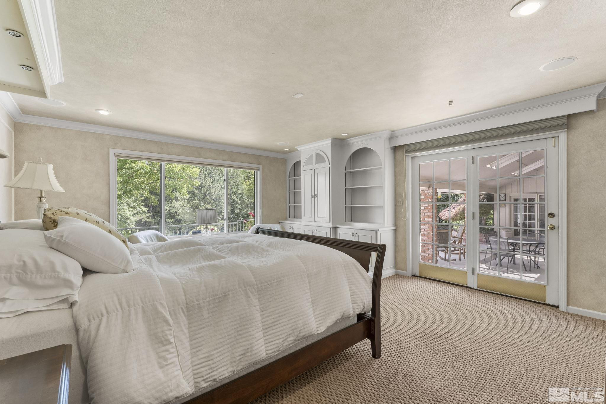 2650 Spinnaker Drive Reno, NV 89519 - Photo 18 of 40 a bed sitting in a spacious bedroom next to a window