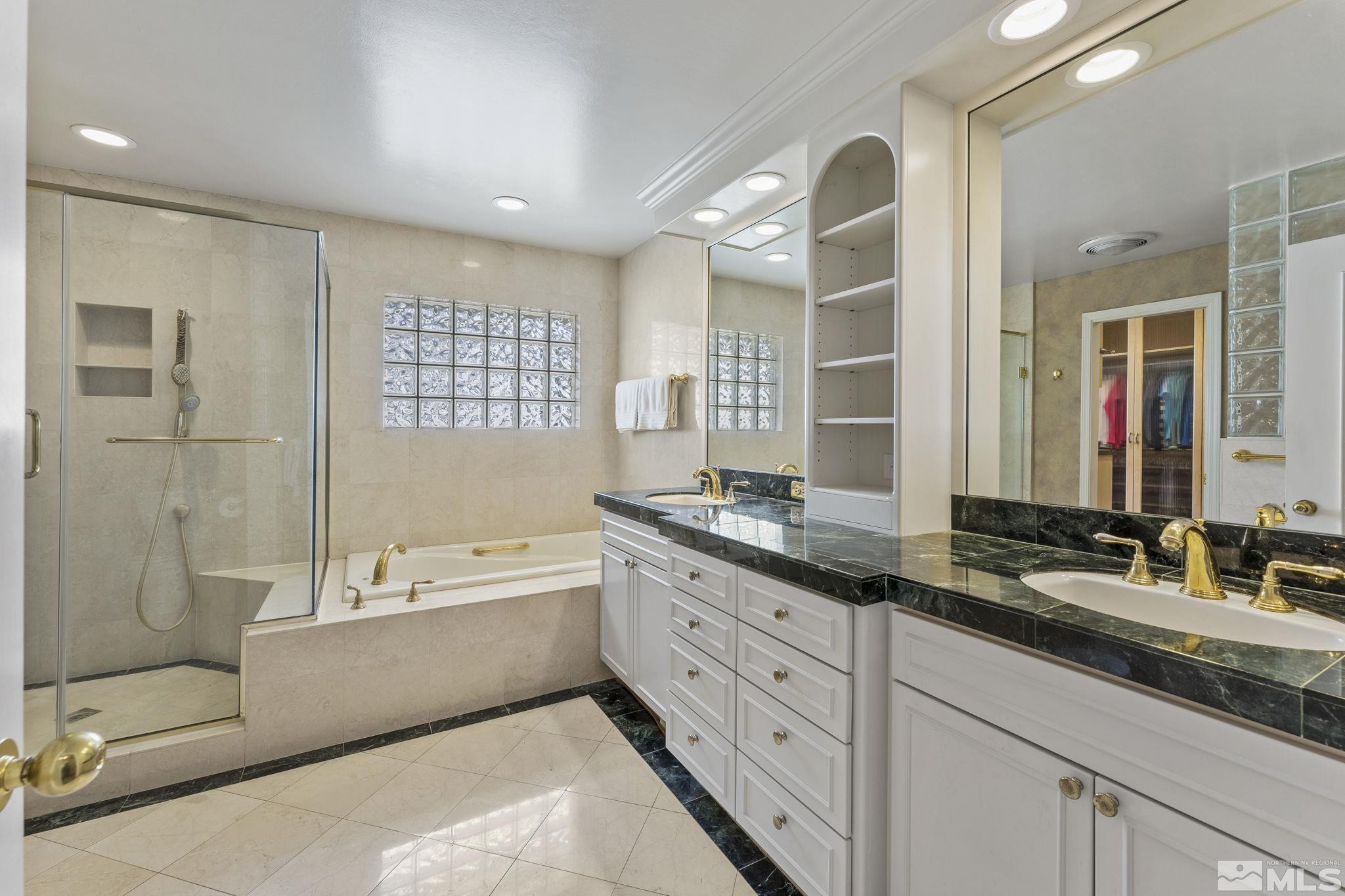 2650 Spinnaker Drive Reno, NV 89519 - Photo 20 of 40 a spacious bathroom with a granite countertop sink mirror and bathtub
