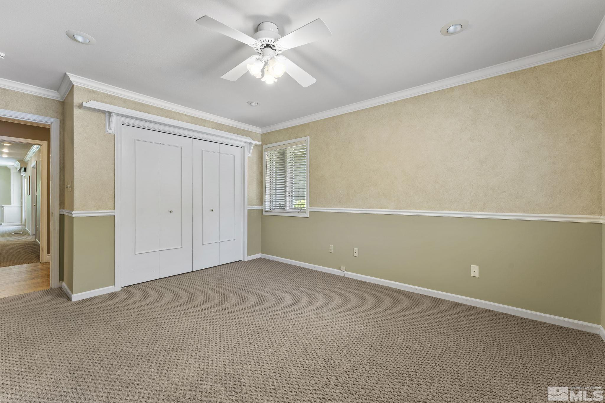 2650 Spinnaker Drive Reno, NV 89519 - Photo 26 of 40 an empty room with a ceiling fan and a window