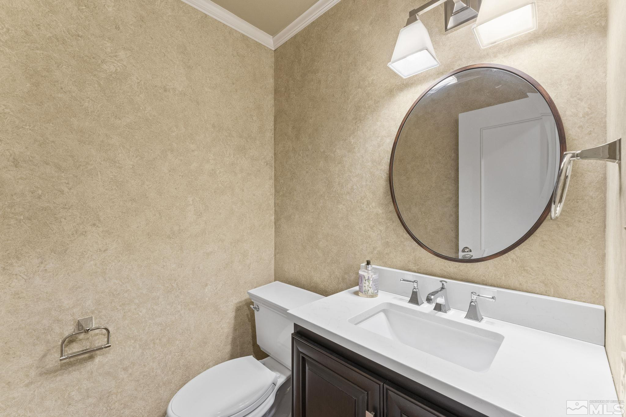 2650 Spinnaker Drive Reno, NV 89519 - Photo 29 of 40 a bathroom with a granite countertop toilet a sink and a mirror