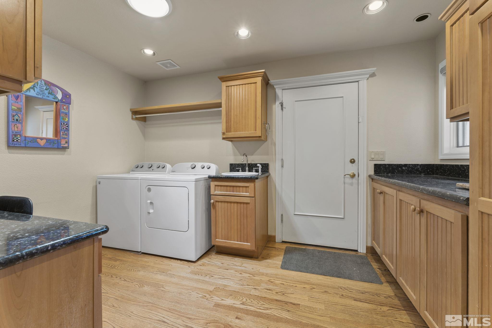 2650 Spinnaker Drive Reno, NV 89519 - Photo 30 of 40 a kitchen with a stove cabinets and wooden floor