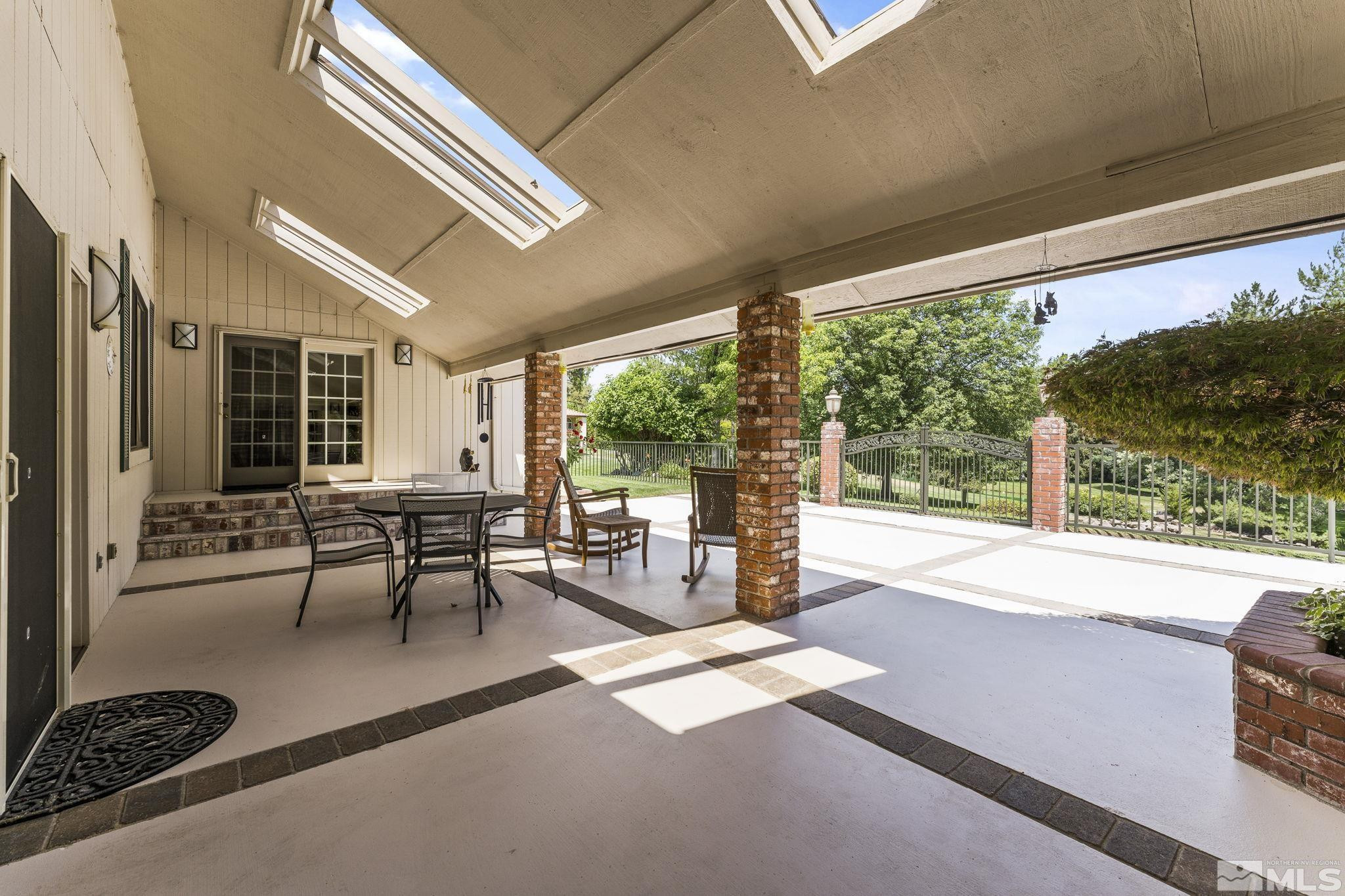 2650 Spinnaker Drive Reno, NV 89519 - Photo 31 of 40 a living room with furniture and large windows