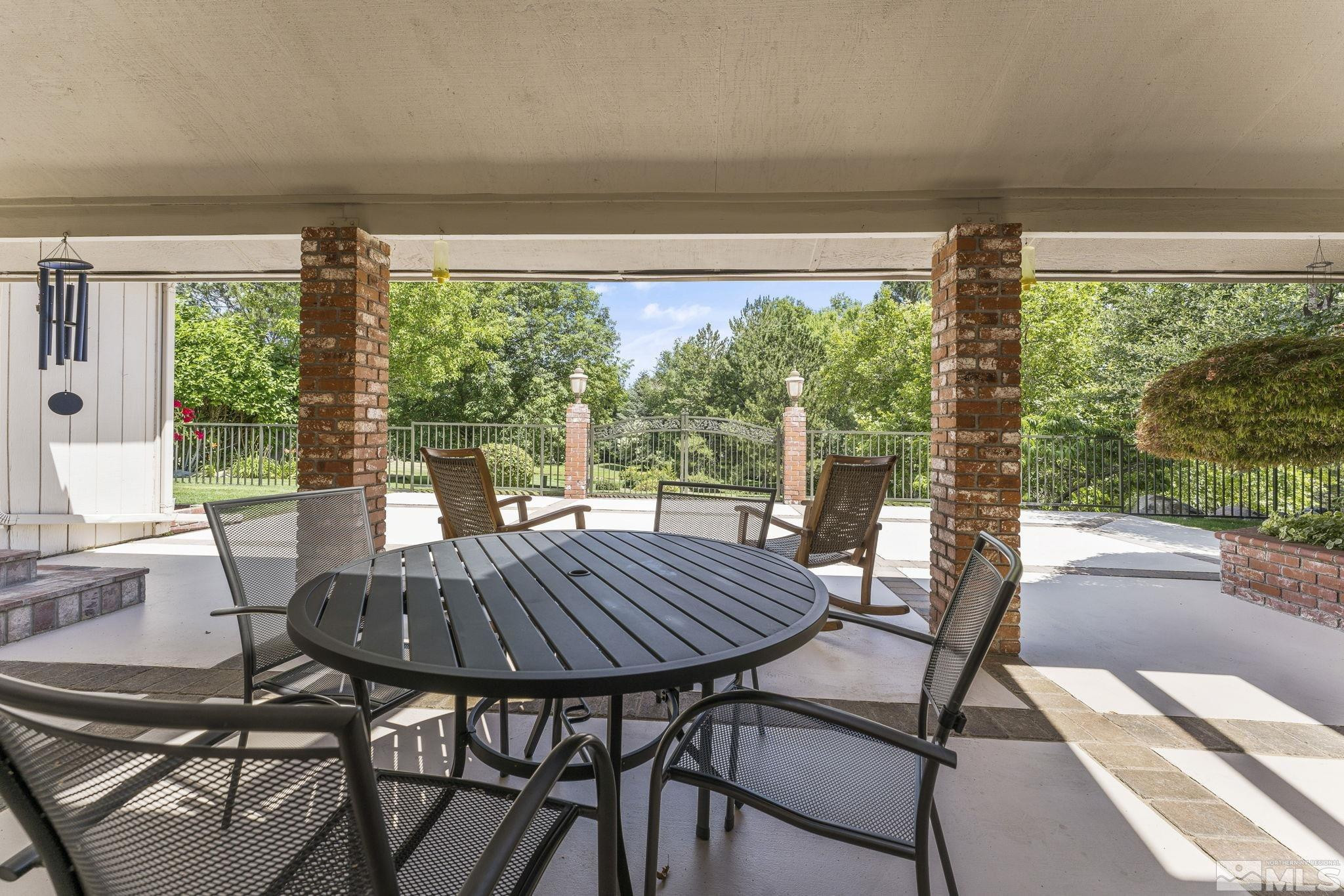 2650 Spinnaker Drive Reno, NV 89519 - Photo 32 of 40 a view of a patio with a table chairs and a table