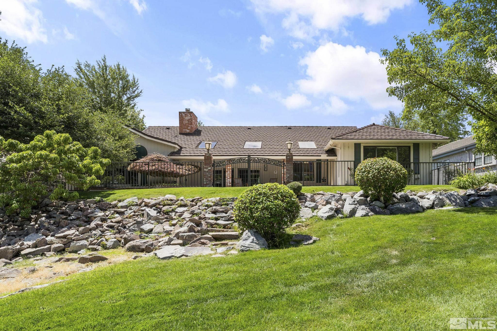 2650 Spinnaker Drive Reno, NV 89519 - Photo 34 of 40 a front view of a house with garden
