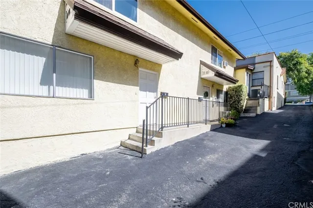 a view of a house with a street