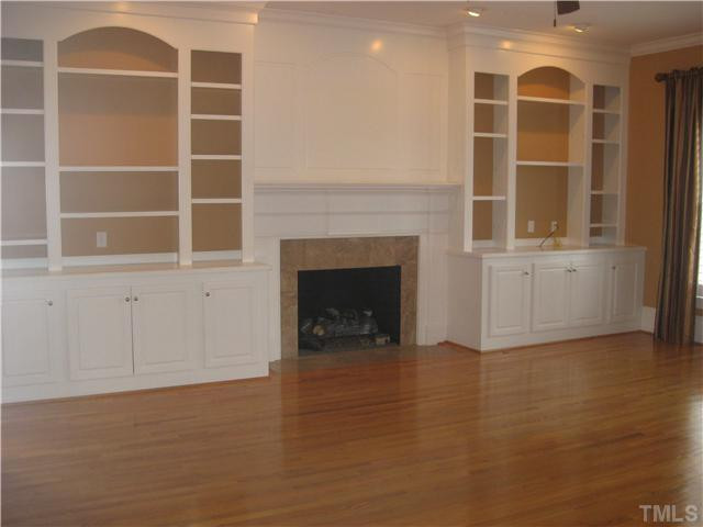 6104 Wilkinsburg Road Raleigh, NC 27612 - Photo 6 of 18 a view of a livingroom with a fireplace