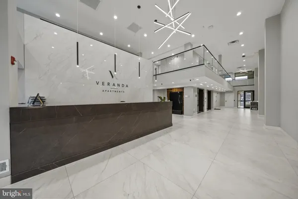 a view of a hallway with living room