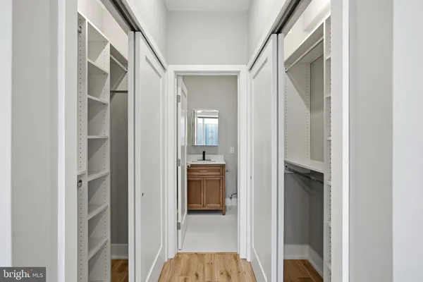 a large kitchen with stainless steel appliances granite countertop a large counter top a stove and a refrigerator