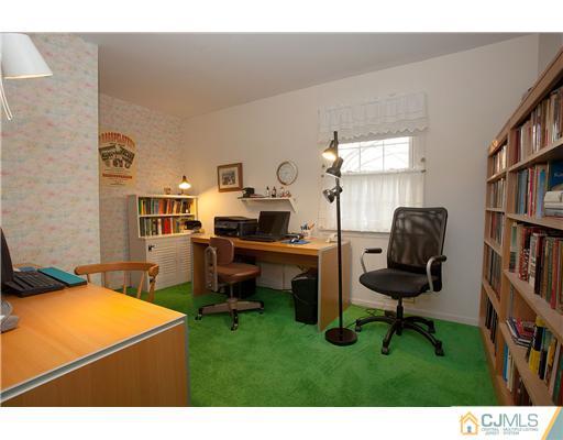 9 Taylor Road Monmouth Junction, NJ 08852 - Photo 22 of 25 a workspace with furniture and a book shelf