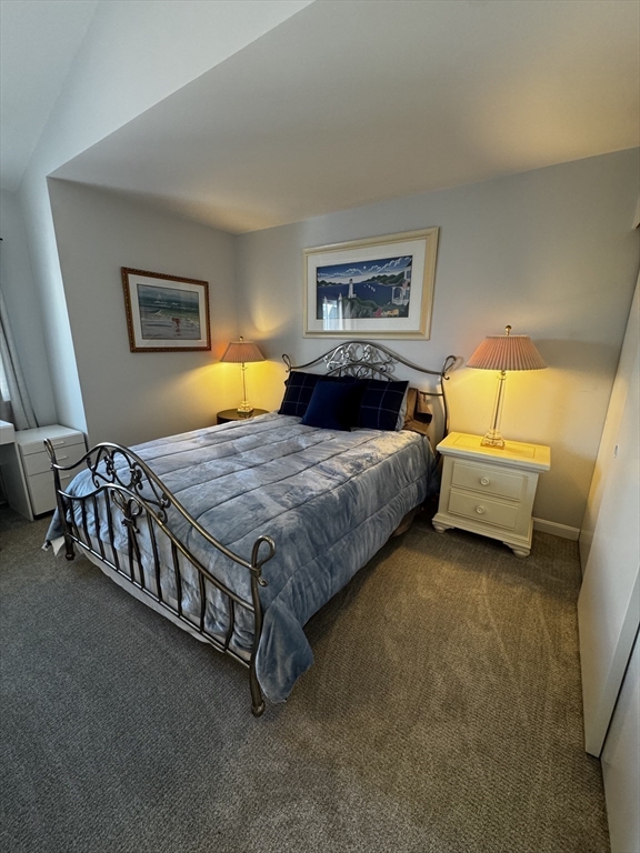 255 North Road, Unit 44 Chelmsford, MA 01824 - Photo 17 of 31 a bedroom with a bed and a couch