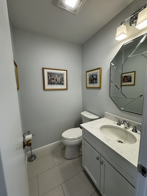 255 North Road, Unit 44 Chelmsford, MA 01824 - Photo 20 of 31 a bathroom with a toilet sink and mirror