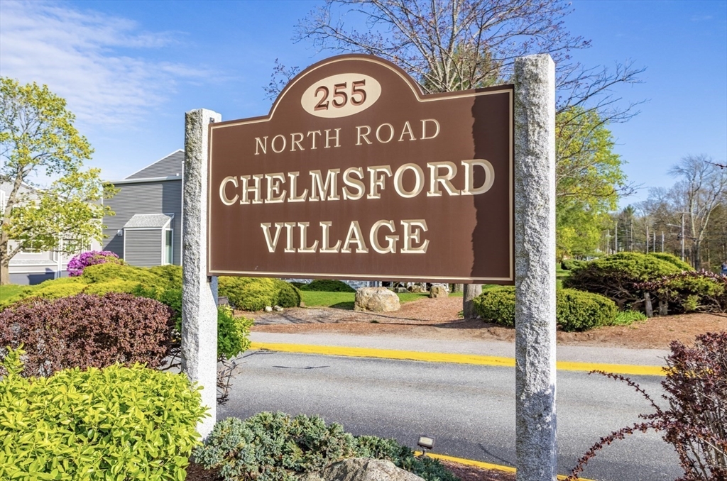 255 North Road, Unit 44 Chelmsford, MA 01824 - Photo 2 of 31 a sign that is on the side of the road