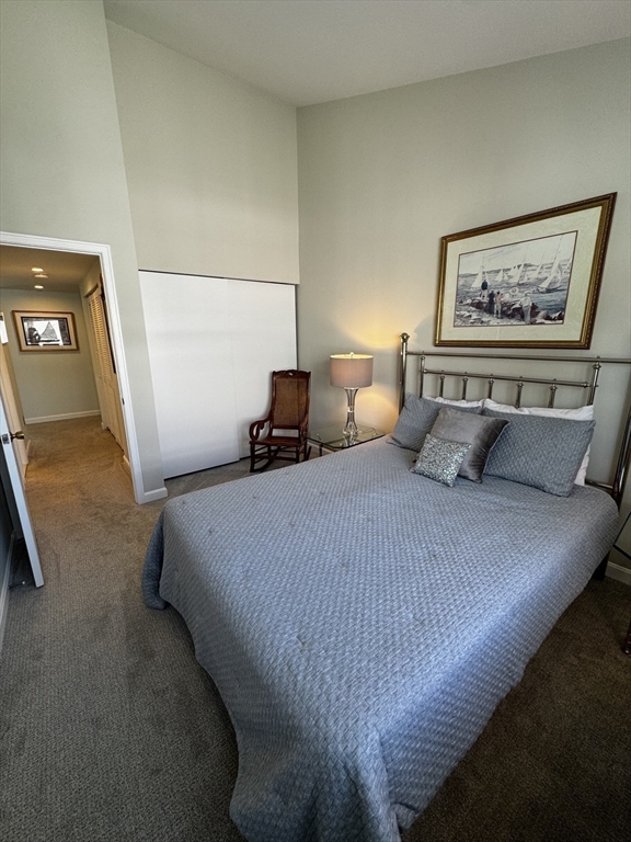 255 North Road, Unit 44 Chelmsford, MA 01824 - Photo 21 of 31 a bed sitting in a bedroom next to a lamp