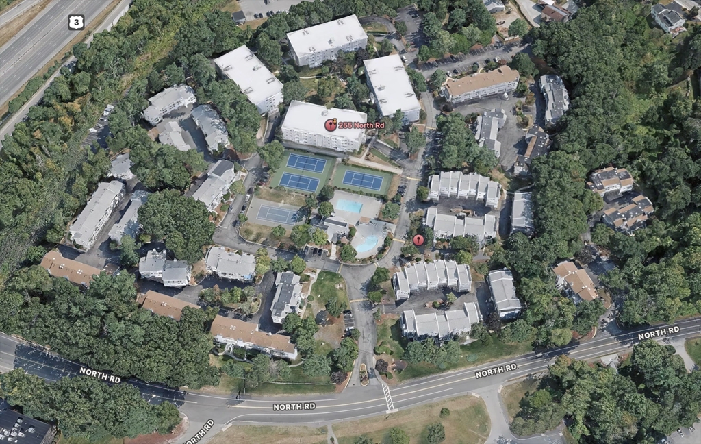 255 North Road, Unit 44 Chelmsford, MA 01824 - Photo 25 of 31 an aerial view of multiple house with yard