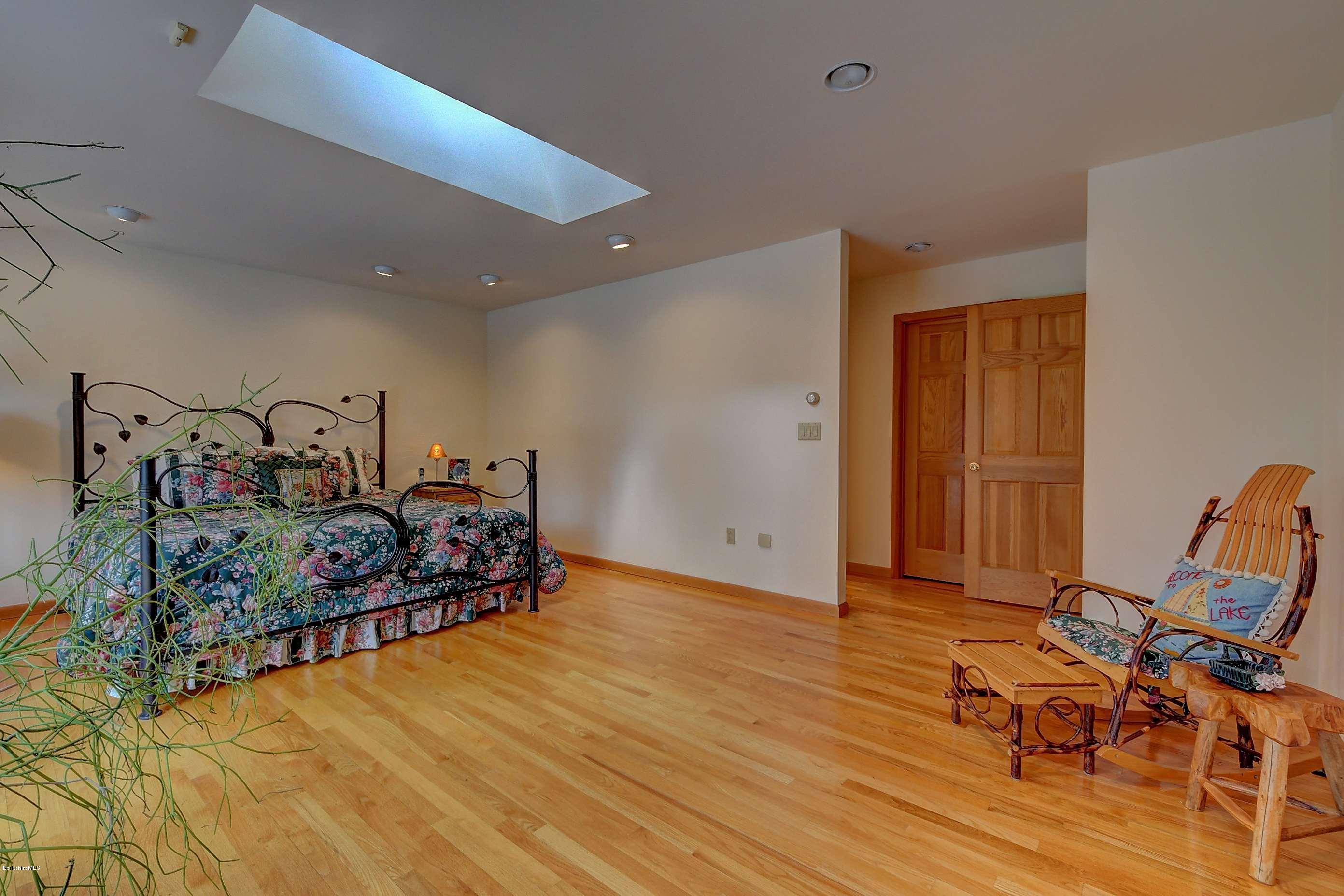 15 Bliven Road Otis, MA 01253 - Photo 17 of 30 a bed room with a bed and a chair