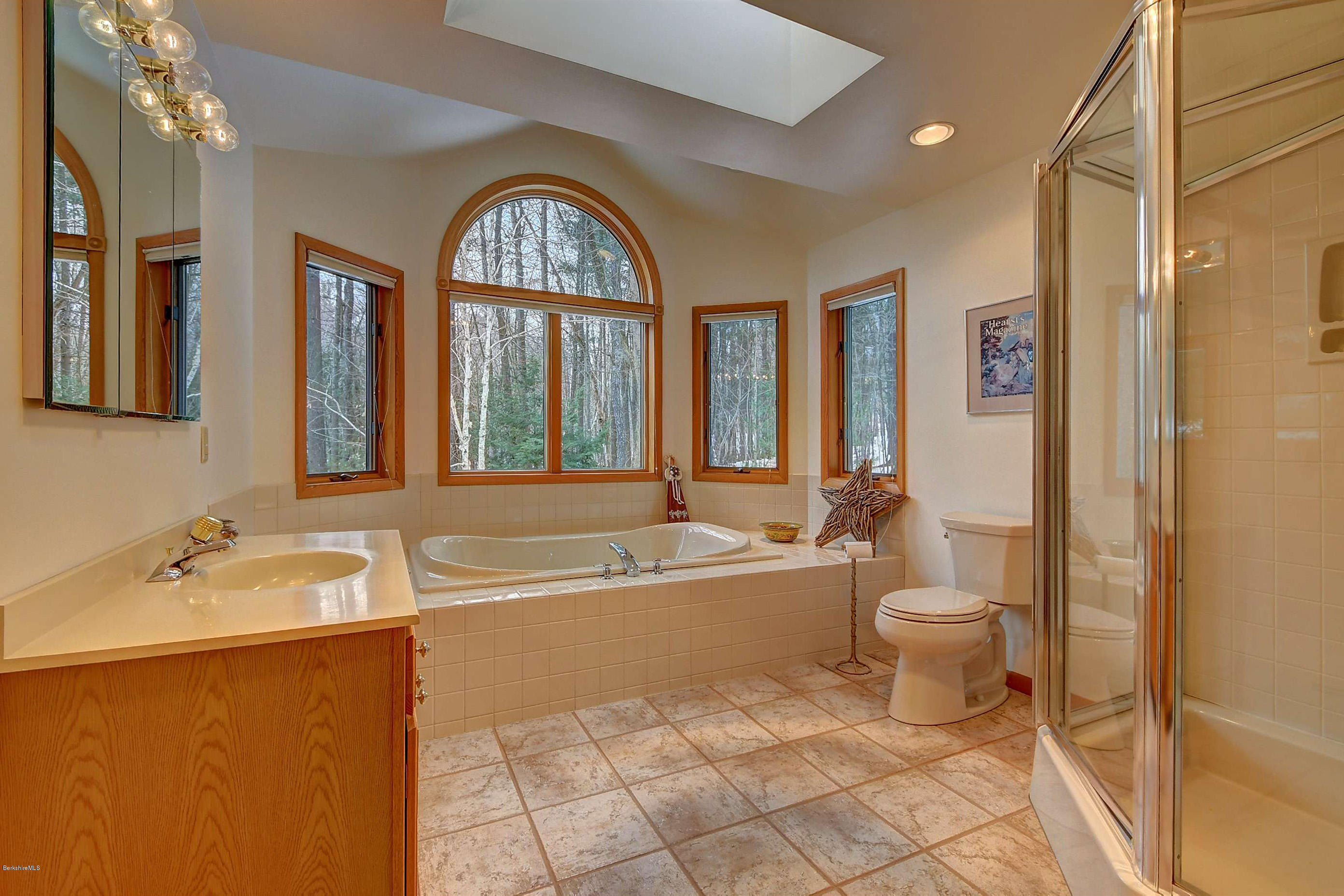 15 Bliven Road Otis, MA 01253 - Photo 18 of 30 a spacious bathroom with a bathtub shower sink mirror and toilet