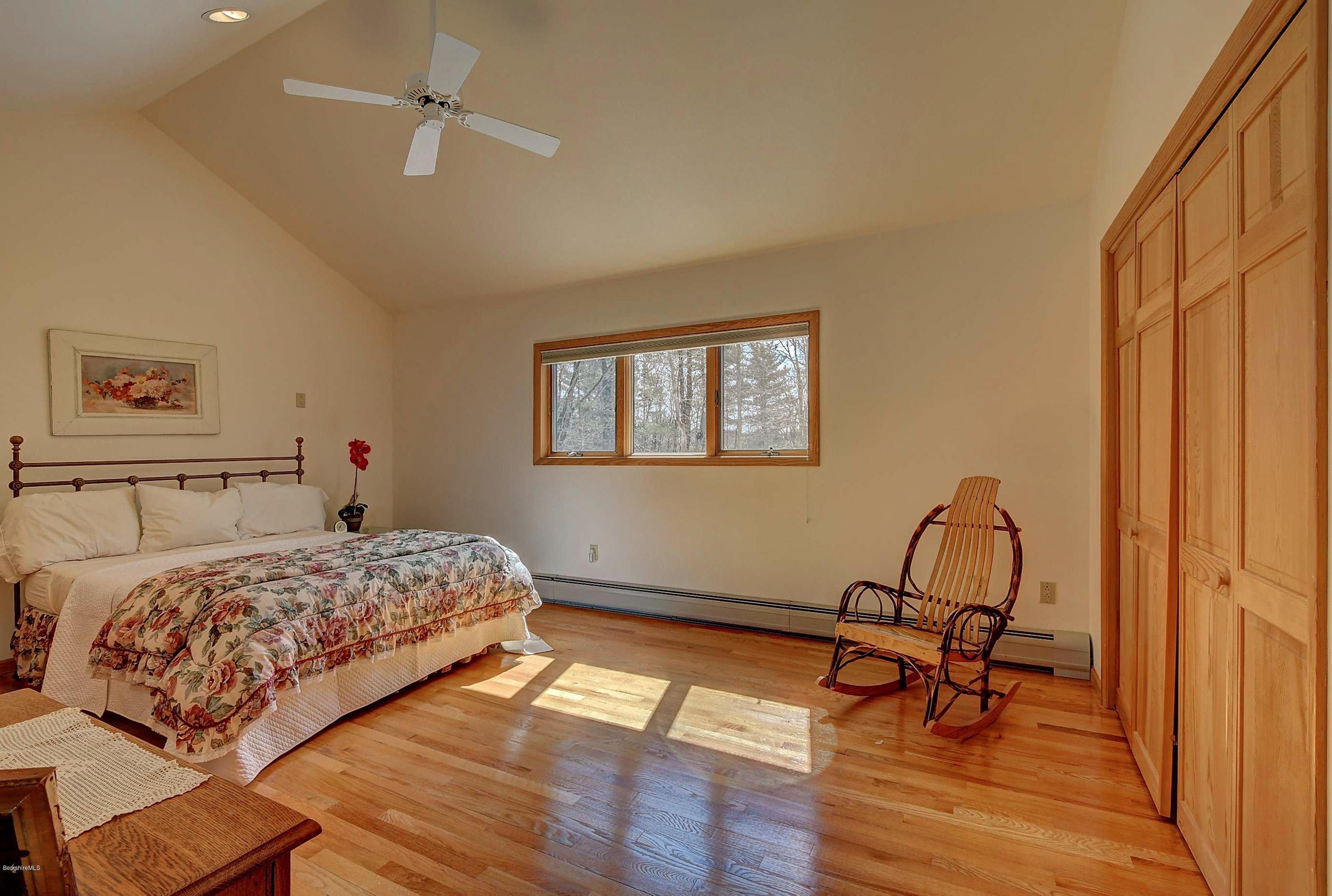 15 Bliven Road Otis, MA 01253 - Photo 23 of 30 a bedroom with a bed a chair and a window