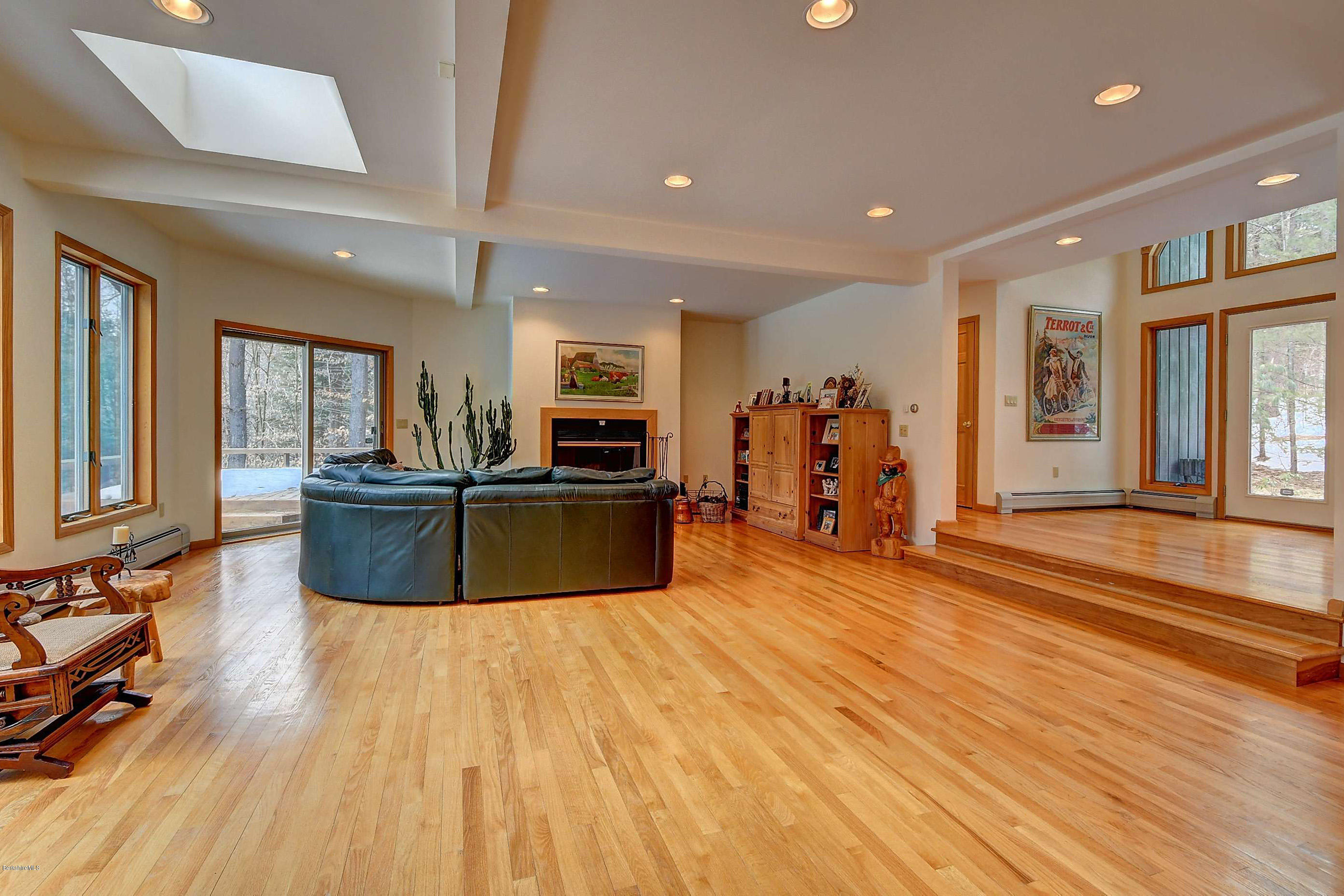 15 Bliven Road Otis, MA 01253 - Photo 7 of 30 a large kitchen with stainless steel appliances wooden floors and large windows