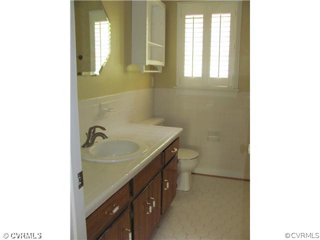 5413 Standing Oak Road Midlothian, VA 23112 - Photo 12 of 12 a bathroom with a sink and a mirror