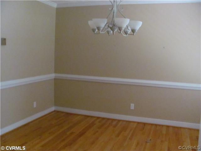 5413 Standing Oak Road Midlothian, VA 23112 - Photo 9 of 12 a view of a room with wooden floor and white walls