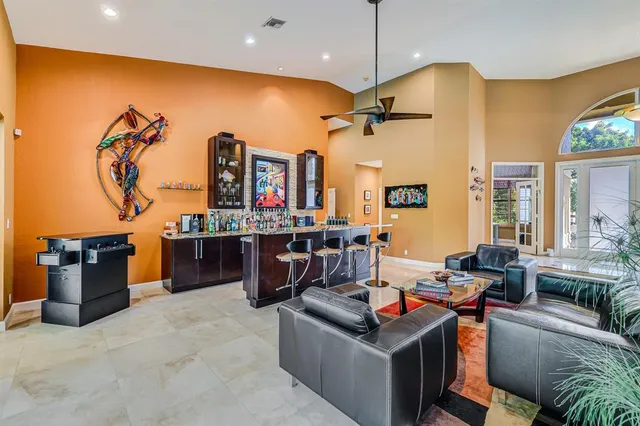 a kitchen with stainless steel appliances granite countertop a sink and a refrigerator