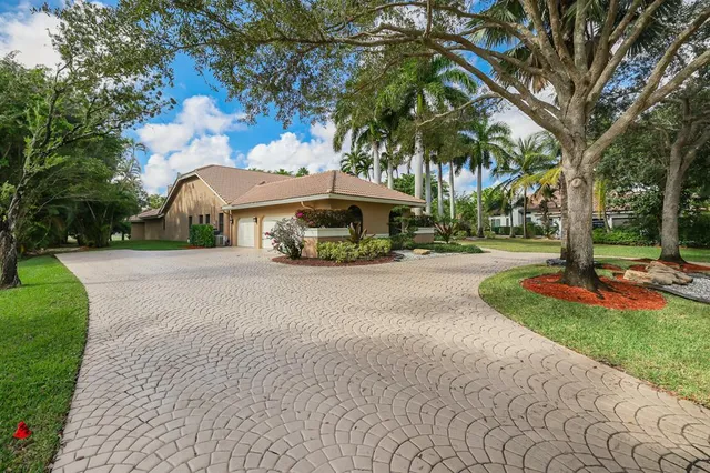 a front view of a house with fountain