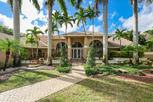 a dining room with a table or chairs and a dining table with garden view