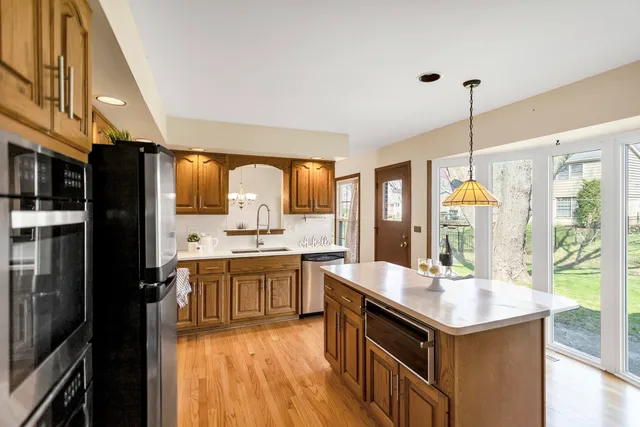 a kitchen with a sink stove and cabinets