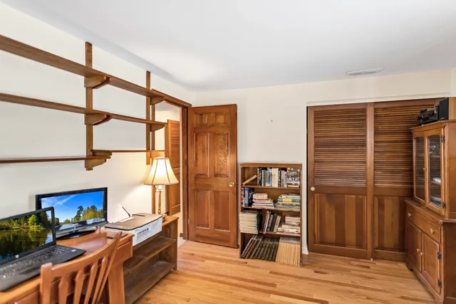 a view of a livingroom with furniture and staircase