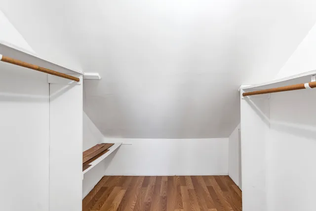 a view of room with wooden floor