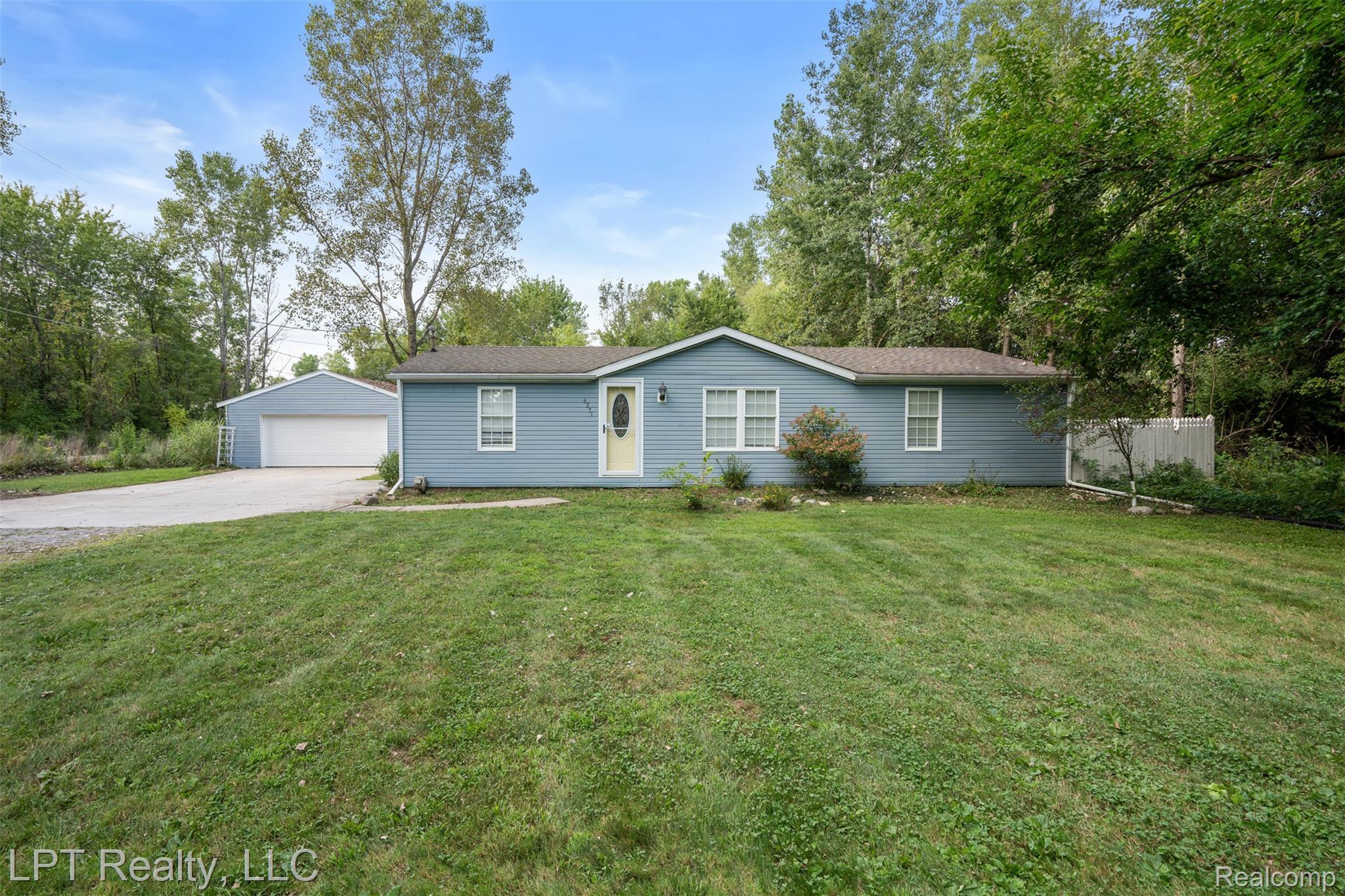 6271 East Potter Road Davison, MI 48423 - Photo 2 of 41 Ranch-style house featuring an outbuilding and a garage