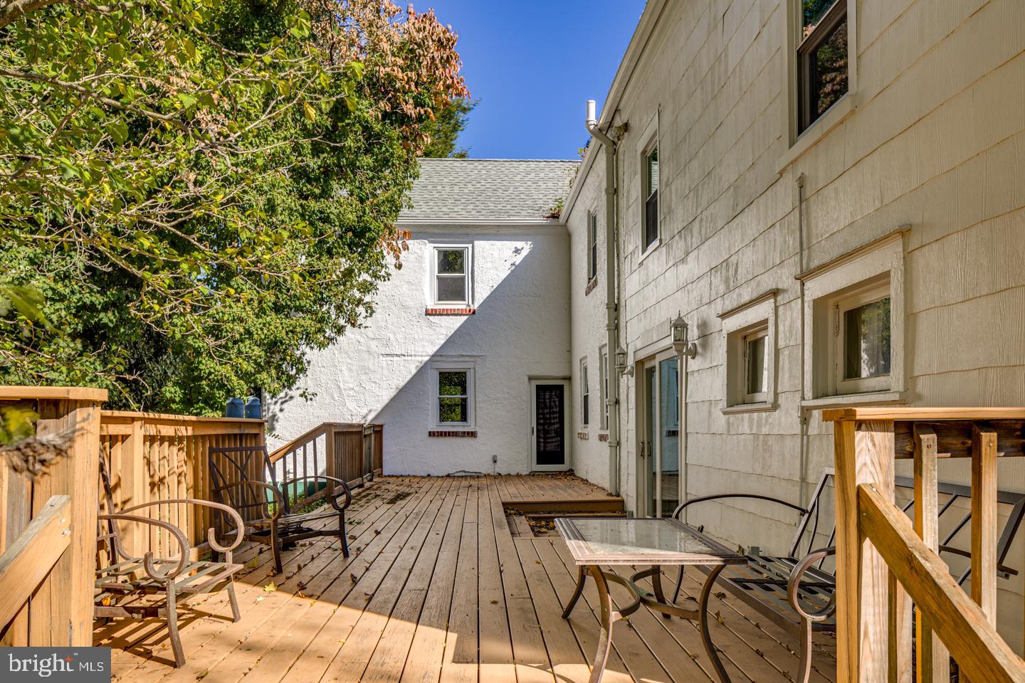 660 South Church Street Mount Laurel, NJ 08054 - Photo 17 of 55 a view of a patio with table and chairs with wooden floor and fence