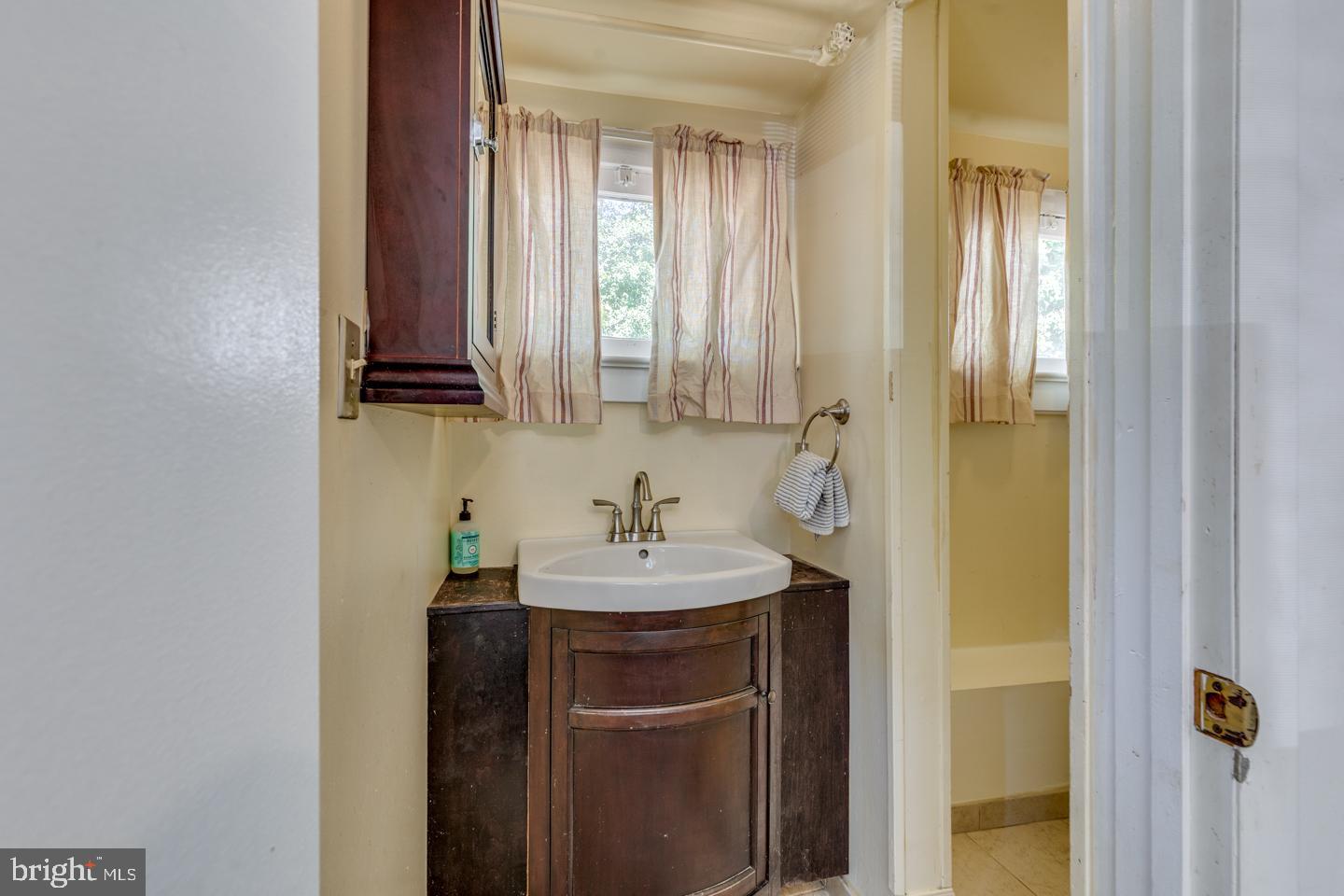 660 South Church Street Mount Laurel, NJ 08054 - Photo 42 of 55 a bathroom with a sink a mirror and a window