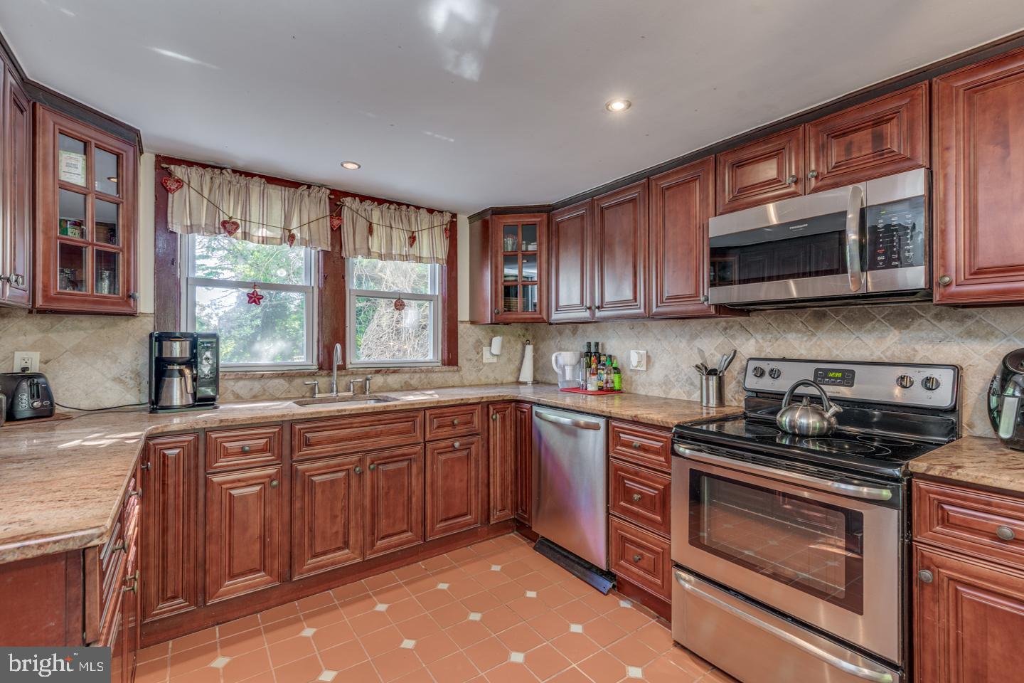 660 South Church Street Mount Laurel, NJ 08054 - Photo 9 of 55 a kitchen with stainless steel appliances granite countertop wooden cabinets a stove top oven a sink and dishwasher