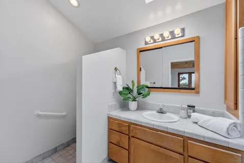 a bathroom with a sink and a mirror