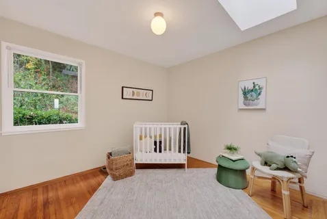 a bedroom with furniture and a window