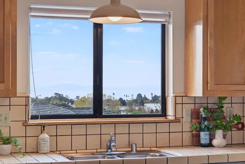 a view of a balcony with furniture