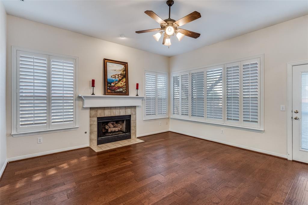 2248 Amy Lane Plano, TX 75074 - Photo 13 of 26 main living area with fireplace and plantation shutters