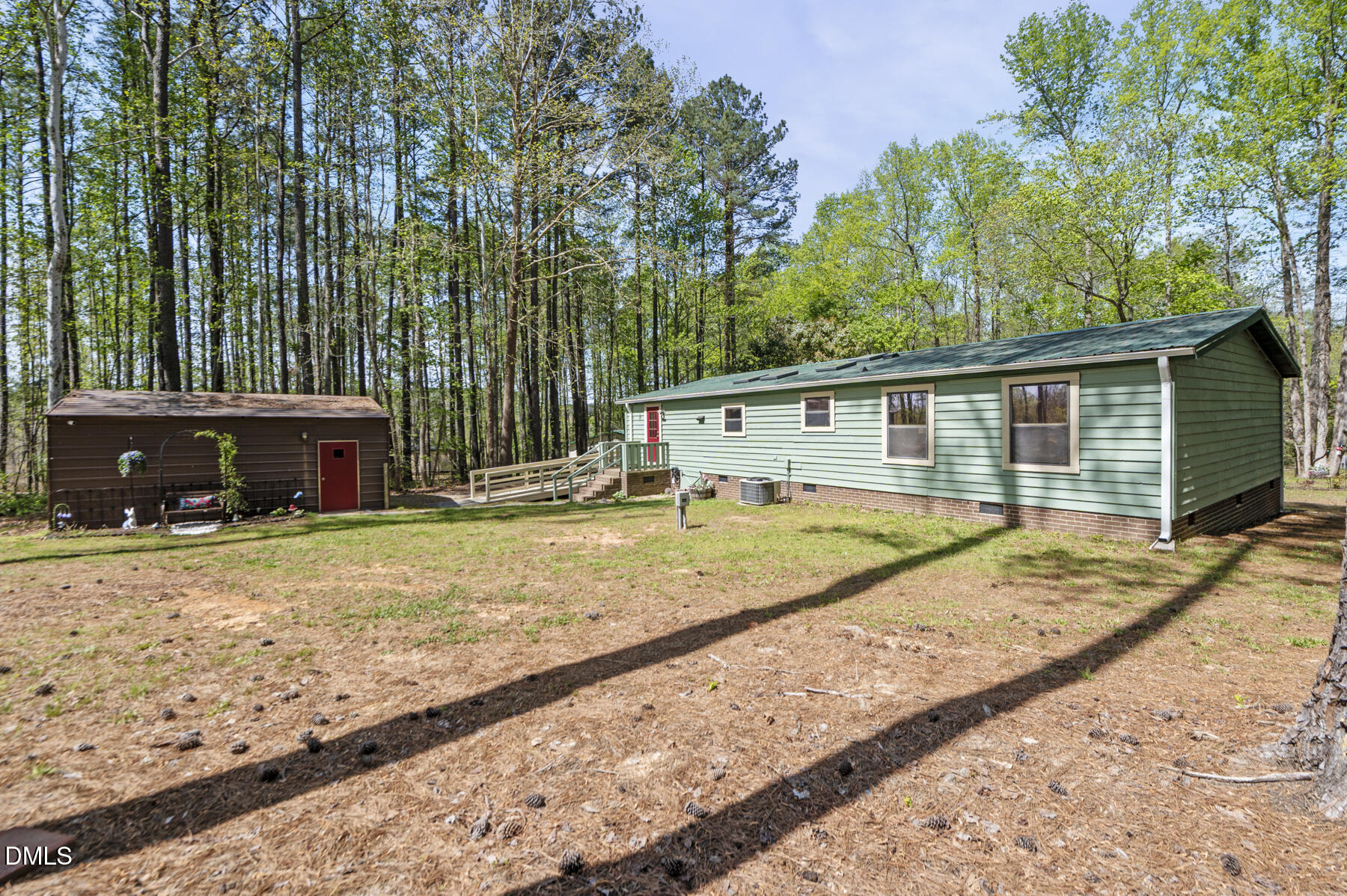 492 Little Mill Road Henderson, NC 27537 - Photo 31 of 39 a view of a house with backyard and sitting area